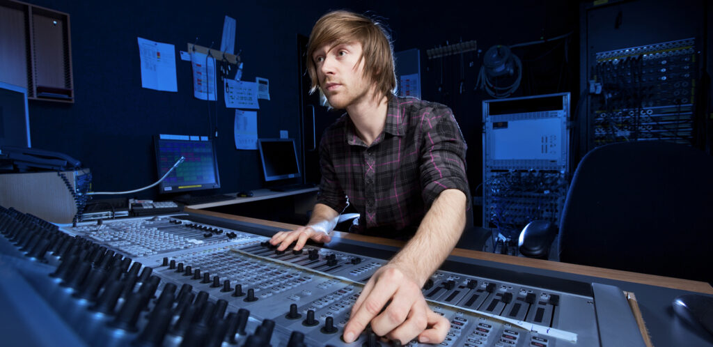 Audio Engineer Mixing Sound in Studio