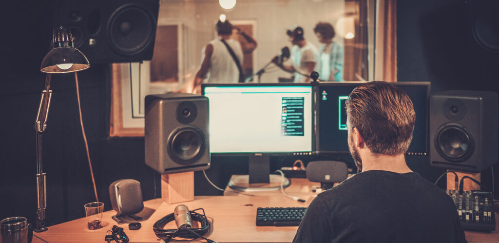 Music Band During CD Recording in Studio
